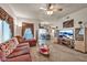 Cozy living room with comfortable seating, and seamless flow into the dining and kitchen area at 7401 W Arrowhead Club Dr # 2067, Glendale, AZ 85308