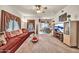 Spacious living room with ceiling fan and view into adjacent dining area at 7401 W Arrowhead Club Dr # 2067, Glendale, AZ 85308
