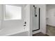Bright bathroom featuring tub and shower with sleek, black shower fixtures and hardware at 8478 W Grovers Ave, Peoria, AZ 85382