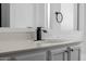Bathroom vanity showcasing black faucet and hardware with bright, clean white color palette at 8478 W Grovers Ave, Peoria, AZ 85382