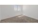 Bedroom featuring neutral carpet and a window with plenty of natural light at 8478 W Grovers Ave, Peoria, AZ 85382