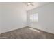 Bedroom featuring neutral carpet and a bright window at 8478 W Grovers Ave, Peoria, AZ 85382