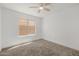 Bedroom featuring neutral carpet, natural light, and a ceiling fan at 8478 W Grovers Ave, Peoria, AZ 85382