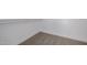 Walk-in closet with neutral color carpet and white trim and shelves at 8478 W Grovers Ave, Peoria, AZ 85382