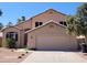Charming single-Gathering home with desert landscaping, a two-car garage, and a covered entrance at 8478 W Grovers Ave, Peoria, AZ 85382