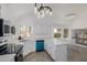 Updated kitchen showcases stainless appliances, bright lighting, and easy access to backyard through sliding glass doors at 8478 W Grovers Ave, Peoria, AZ 85382