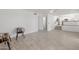 Open-concept living room with tiled floor, ceiling fan, and a bright and airy design at 8478 W Grovers Ave, Peoria, AZ 85382