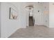 A brightly lit, open floor plan featuring stairs and modern pendant lighting at 8478 W Grovers Ave, Peoria, AZ 85382
