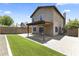 Fenced backyard with grass, patio, and home, perfect for entertaining and relaxation at 8876 W Bluefield Ave, Peoria, AZ 85382