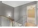 Upstairs hallway with tiled floors and natural light entering from the bedroom at 8876 W Bluefield Ave, Peoria, AZ 85382