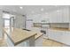 Bright kitchen with white cabinets, a breakfast bar, and matching appliances at 8876 W Bluefield Ave, Peoria, AZ 85382