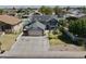Expansive aerial view of a two-story home enhanced with solar panels and manicured landscaping at 8908 W Sheridan St, Phoenix, AZ 85037
