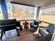 Cozy covered balcony featuring comfortable seating and a grill at 8908 W Sheridan St, Phoenix, AZ 85037