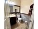 Cozy half bathroom with a stylish vanity, mirror, and decorative accents at 8908 W Sheridan St, Phoenix, AZ 85037