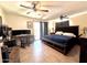 Primary bedroom featuring two ceiling fans and a sliding glass door to the back yard at 8908 W Sheridan St, Phoenix, AZ 85037