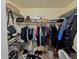 Organized walk-in closet with shelving and rods providing ample storage at 8908 W Sheridan St, Phoenix, AZ 85037