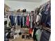 Spacious walk-in closet providing ample storage and organization at 8908 W Sheridan St, Phoenix, AZ 85037