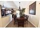 Elegant dining room with a large table and chairs, ideal for Gathering gatherings and entertaining guests at 8908 W Sheridan St, Phoenix, AZ 85037
