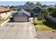 Charming blue two-story home featuring solar panels, a spacious driveway, and well-maintained landscaping at 8908 W Sheridan St, Phoenix, AZ 85037
