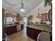 Open-concept kitchen with stainless steel appliances and ample counter space, perfect for entertaining at 8908 W Sheridan St, Phoenix, AZ 85037