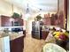 Bright kitchen featuring granite countertops, dark cabinetry, and modern stainless steel appliances at 8908 W Sheridan St, Phoenix, AZ 85037