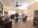 Spacious living room featuring vaulted ceilings, tile flooring, and a ceiling fan at 8908 W Sheridan St, Phoenix, AZ 85037