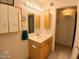 Bright bathroom features wood vanity and overhead lighting at 9726 E Quarterline Rd, Mesa, AZ 85207