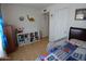 This bedroom includes a storage unit and a dinosaur wall hanging at 9726 E Quarterline Rd, Mesa, AZ 85207