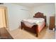 Comfortable bedroom with wood-look floors and closet at 9726 E Quarterline Rd, Mesa, AZ 85207