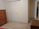 Cozy bedroom features ample closet space and warm carpeting at 9726 E Quarterline Rd, Mesa, AZ 85207