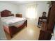 Bedroom with natural light, wood-look floors, and dresser at 9726 E Quarterline Rd, Mesa, AZ 85207
