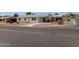 Quaint single-story home featuring a covered parking area, simple landscaping, and inviting curb appeal at 9726 E Quarterline Rd, Mesa, AZ 85207