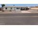 Charming single-story home with a driveway and simple, low-maintenance desert landscaping at 9726 E Quarterline Rd, Mesa, AZ 85207