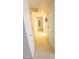 Long hallway with white doors and tiled floor at 9726 E Quarterline Rd, Mesa, AZ 85207
