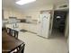 Functional kitchen featuring white appliances, cabinets, and ample counter space at 9726 E Quarterline Rd, Mesa, AZ 85207
