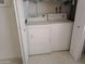 Bright laundry room with white washer and dryer conveniently located at 9726 E Quarterline Rd, Mesa, AZ 85207