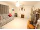 Bright living room featuring a comfortable couch, tile floors, and ceiling fan at 9726 E Quarterline Rd, Mesa, AZ 85207