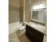 Bathroom features a bathtub with tile surround, toilet, and vanity with granite countertop at 10136 E Southern Ave # 3109, Mesa, AZ 85209
