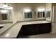 Bathroom featuring dual sinks, granite countertop, and ample cabinet storage at 10136 E Southern Ave # 3109, Mesa, AZ 85209