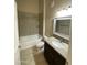 Bathroom features a bathtub with tile surround, toilet, and vanity with granite countertop at 10136 E Southern Ave # 3109, Mesa, AZ 85209