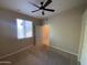 Bedroom featuring a ceiling fan, closet, window, and carpet flooring at 10136 E Southern Ave # 3109, Mesa, AZ 85209