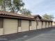Exterior view of multiple garages in a row, each with a tile roof and unit number at 10136 E Southern Ave # 3109, Mesa, AZ 85209