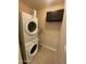 The laundry room features a stacked washer and dryer plus additional cabinet space at 10136 E Southern Ave # 3109, Mesa, AZ 85209