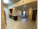Spacious living area leading to kitchen with stainless steel appliances and granite countertops at 10136 E Southern Ave # 3109, Mesa, AZ 85209