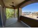 A private patio is furnished with an outdoor ceiling fan and a view of nearby trees and community at 10136 E Southern Ave # 3109, Mesa, AZ 85209