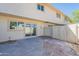 Enclosed backyard with hardscape, block fencing, and slider to interior at 1061 E Fremont Dr, Tempe, AZ 85282