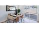 Cozy dining area with modern table setting, a mirror, and sliding glass doors to the backyard at 1061 E Fremont Dr, Tempe, AZ 85282