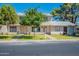 Inviting two-story townhouses with well-maintained lawns and mature trees offer comfortable living at 1061 E Fremont Dr, Tempe, AZ 85282