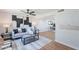 Bright and airy living room with stylish decor, hardwood floors, and access to the dining area at 1061 E Fremont Dr, Tempe, AZ 85282