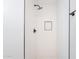 Modern shower with white tiling, a rainfall shower head, and a built-in niche for toiletries at 1061 E Fremont Dr, Tempe, AZ 85282
